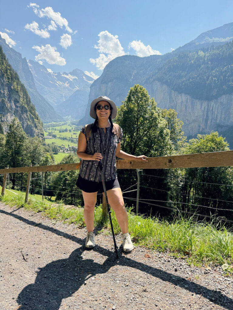 On the Männlichen to Wengen trail with hiking poles, the valley behind